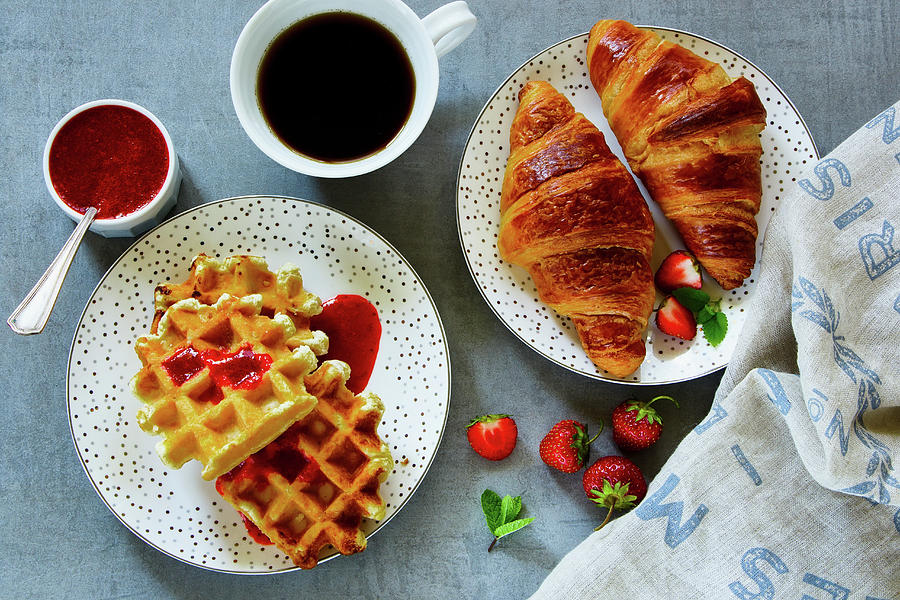Close Up Of Breakfast Table With Fresh Baked Croissants And Waffles, Served With Coffee, Strawberries And Homemade Berry Jam Photograph by Yuliya Gontar