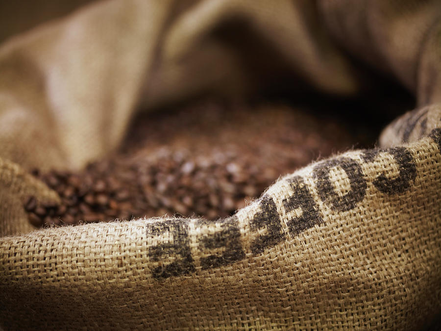 Close Up Of Burlap Sack With Coffee Photograph by Adam Gault