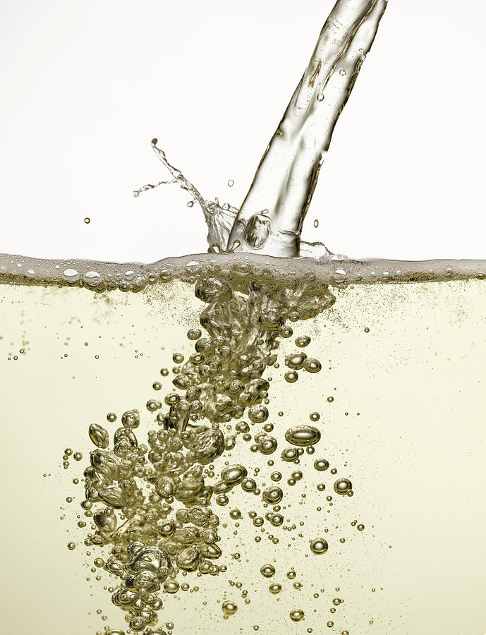 Close Up Of Champagne Being Poured Photograph by Andy Roberts