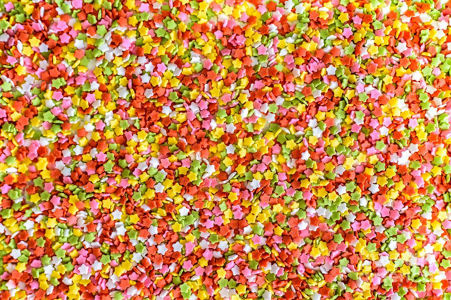 Close-up of colorful little stars made of sugar to decorate desserts, culinary background. Photograph by Joaquin Corbalan