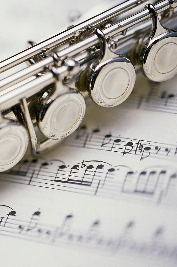 Music Photograph - Close-up Of Flute On Sheet Music by Comstock