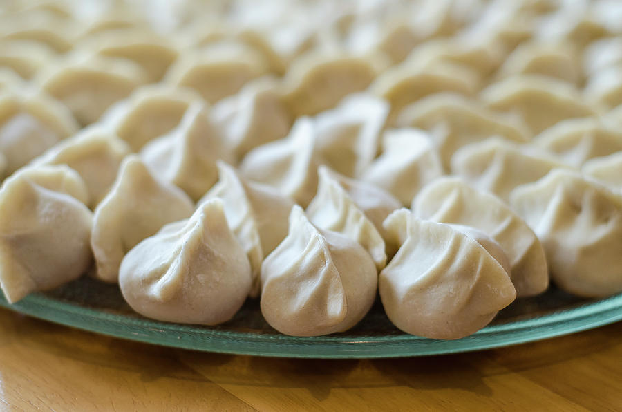 Close Up Of Freshly Home Made Chinese Dumplings On A Glass Plate And Wooden Table Photograph by Giulia Verdinelli Photography