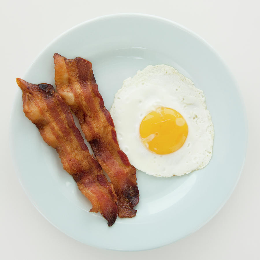 Close Up Of Fried Egg With Bacon Photograph by Jamie Grill