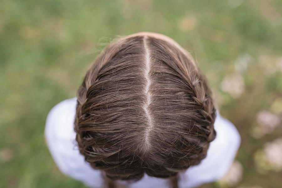 Nature Photograph - Close-up Of Girls Hairstyle Outdoors by Cavan Images