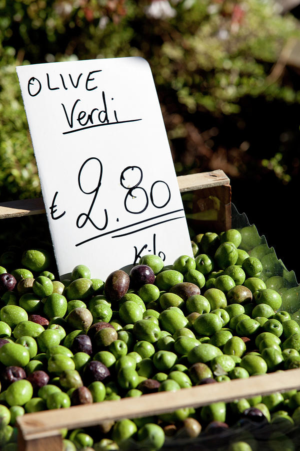 Still Life Photograph - Close-up Of Green Olives In Market, Bellagio by Jalag / Joerg Lehmann