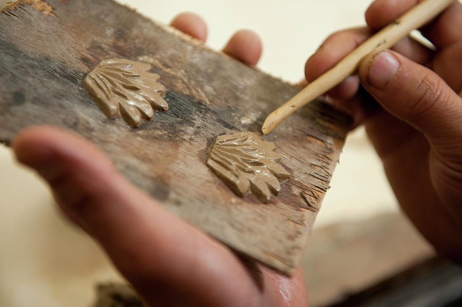 Seasons Photograph - Close-up Of Human Hand Making Clay Art With Stick At Art School In Thimpu, Bhutan by Lukas Larsson Jalag