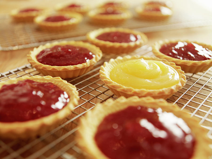 Close Up Of Jam Tarts Cooling On Wire Photograph by Adam Gault