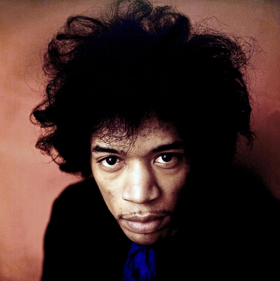 Jimi Hendrix Photograph - Close-up Of Jimi Hendrix Against Orange Background by Globe Photos
