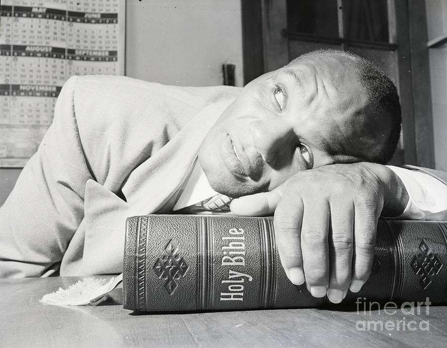 Close-up Of Joe Walcott Resting On Bible Photograph by Bettmann Close-up Of Joe Walcott Resting On Bible Photograph by Bettmann