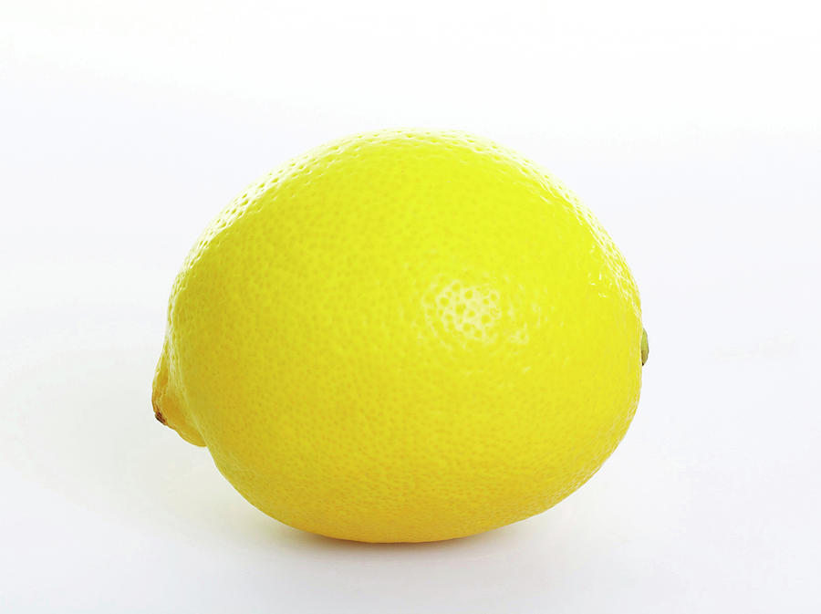 Close-up Of Lemon On White Background Photograph by Jalag-fotostudio,