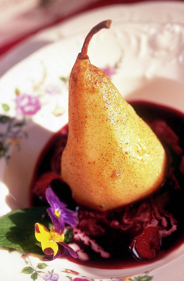 Close-up Of Pear With Raspberry Sauce In Bowl Photograph by Jalag / Alan Ginsburg