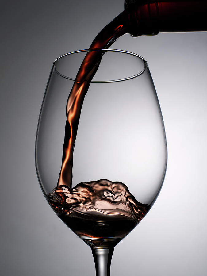 Close Up Of Red Wine Being Poured Into Photograph by Johner Images
