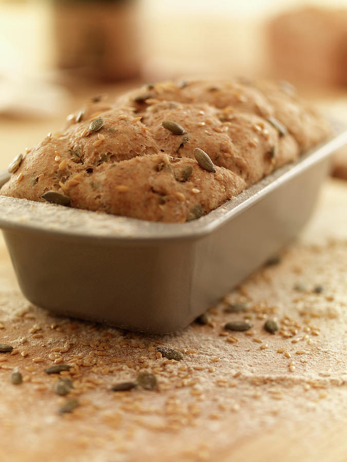 Close Up Of Rustic Bread In Loaf Pan Photograph by Adam Gault