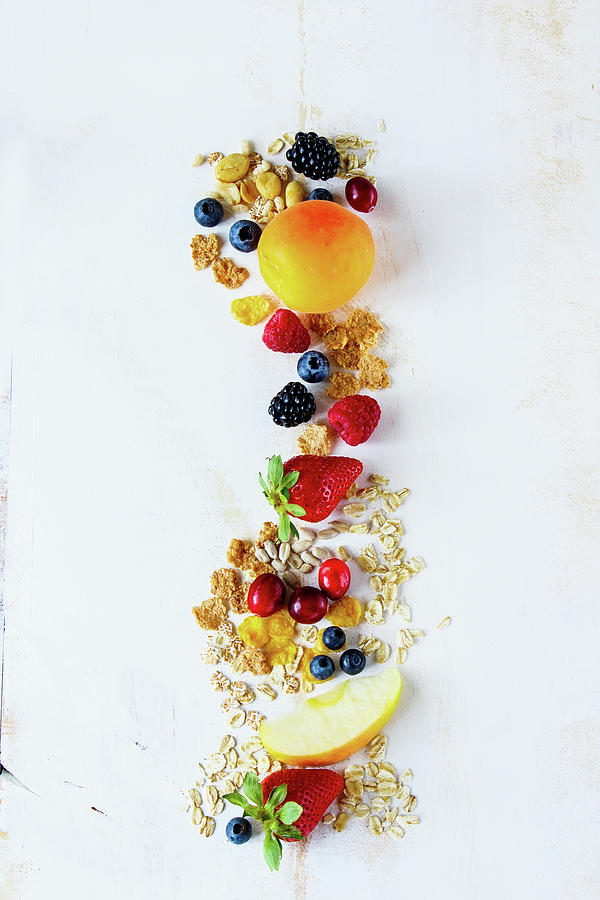 Close Up Of Tasty Breakfast Or Smoothie Ingredients. Various Grains, Seeds, Fresh Berries And Fruits On White Rustic Backdrop Photograph by Yuliya Gontar