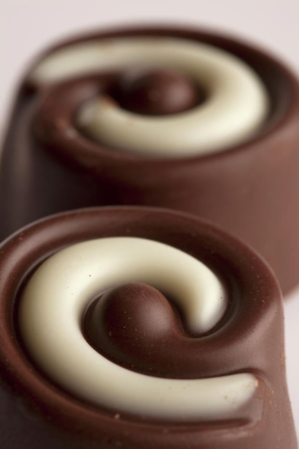 Close-up Of Two Chocolates Photograph by Larry Washburn