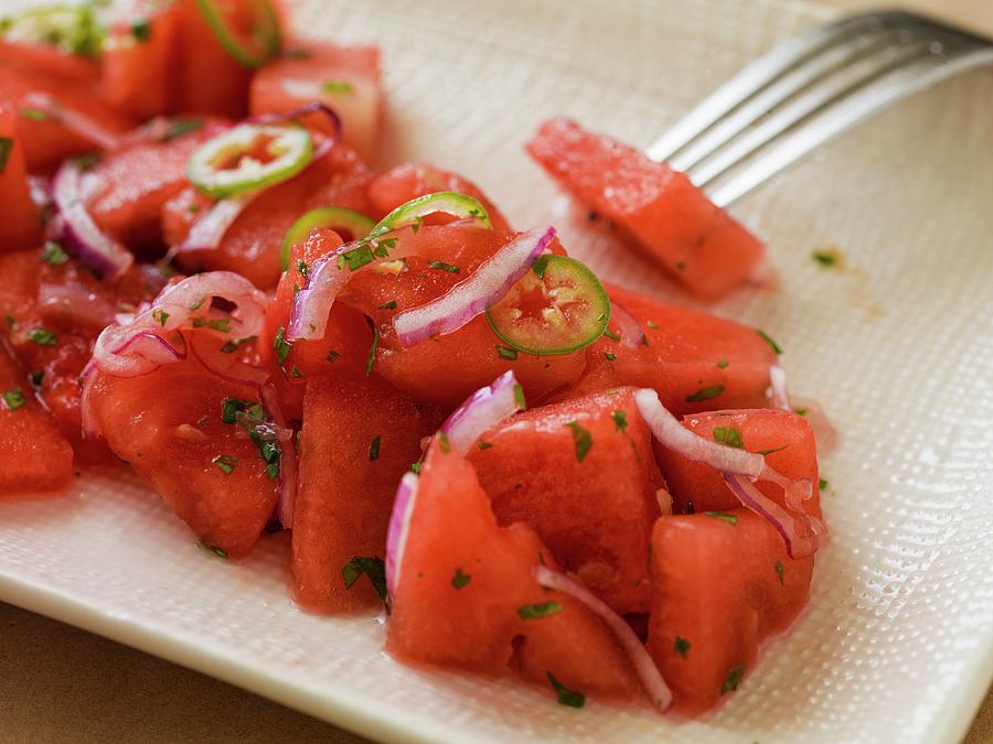 Close-up Of Watermelon Salad With Onions And Serrano Peppers On A Rectangular Plate With A Linen Texture Photograph by Don Crossland
