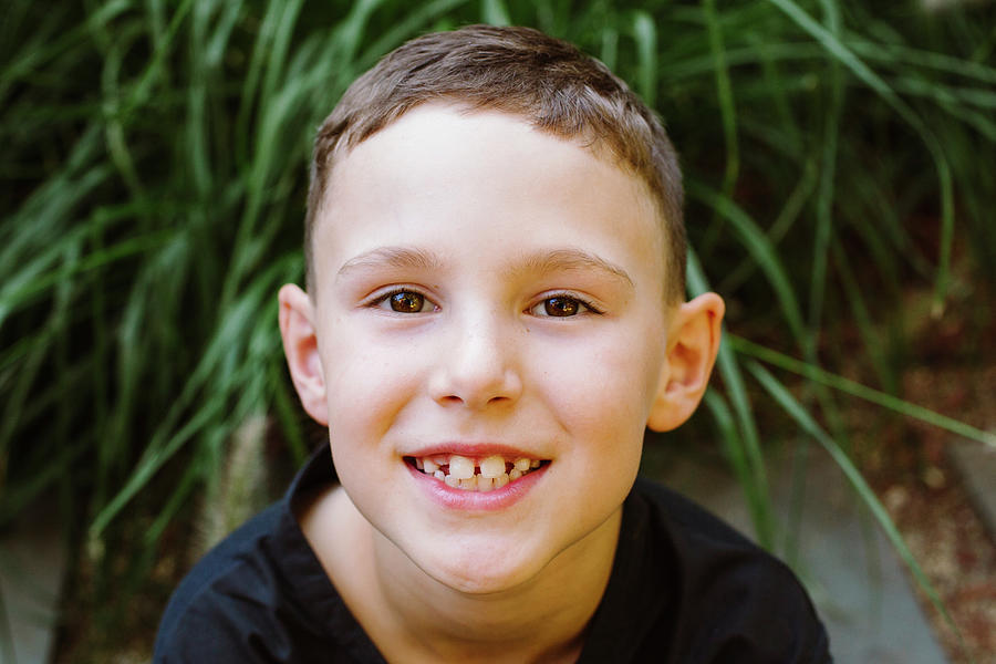 Nature Photograph - Close-up Portrait Of A Smiling Young Boy by Cavan Images