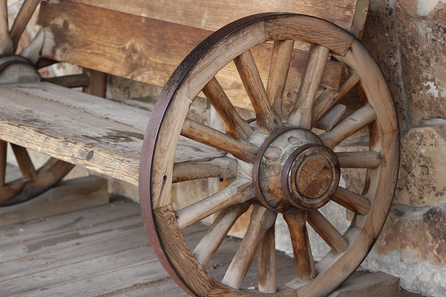 Closeup of Wagon Wheel Bench Photograph by Colleen Cornelius