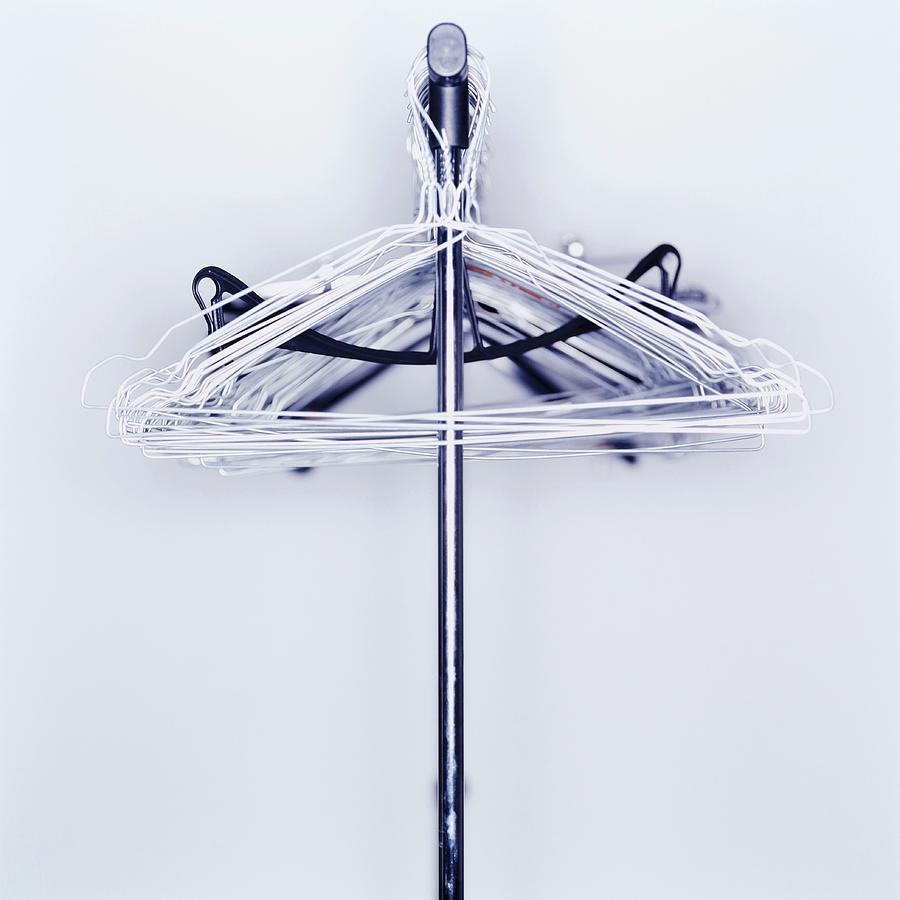 Furniture Photograph - Clothes Hangers On A Rod by Oliver Lippert