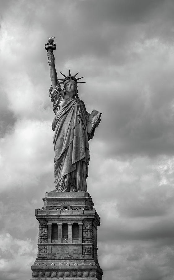 Clouds Behind Lady Liberty In Black and White Photograph by Greg and Chrystal Mimbs