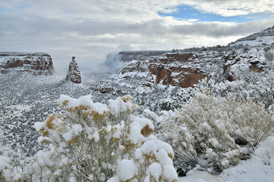 Clouds Break over Snow Covered Independence Canyon Photograph by Ray Mathis