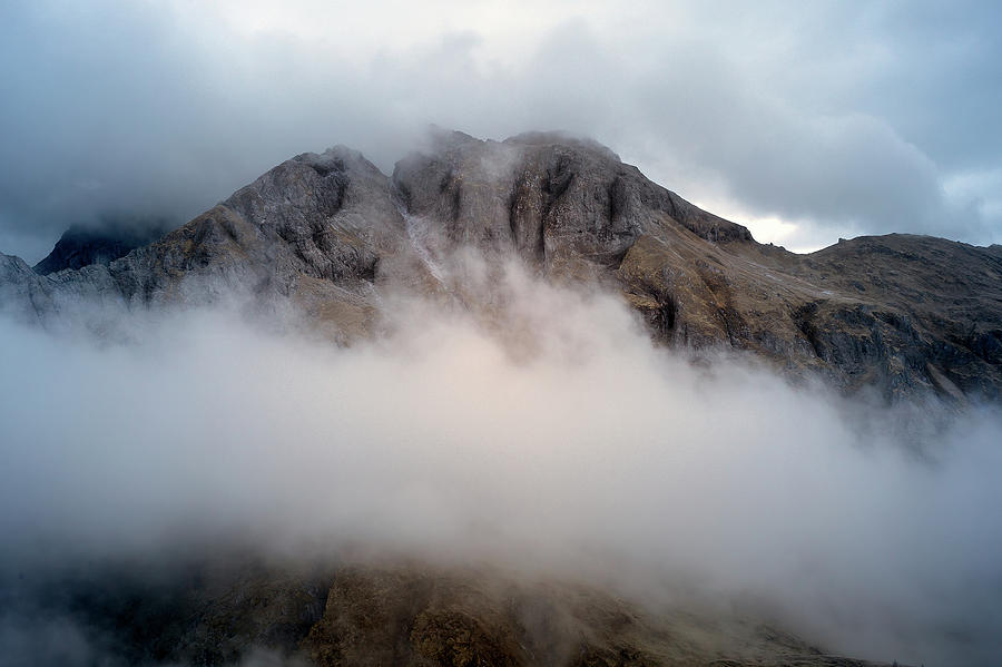 Clouds in the Dolomites Photograph by Jon Glaser