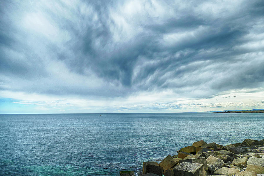 Clouds meet the sea in the harbor  Photograph by Steve Estvanik