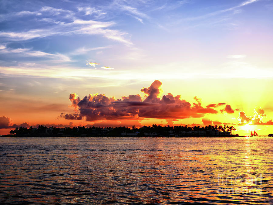 Clouds Over Sunset Key at Night in Key West Photograph by John Rizzuto