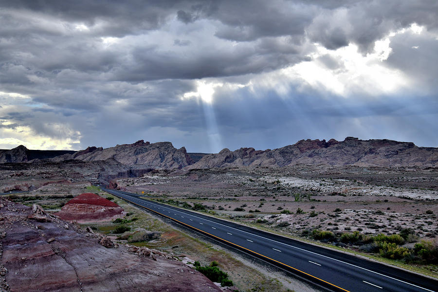Clouds Part above San Rafael Swell and I-70 Photograph by Ray Mathis