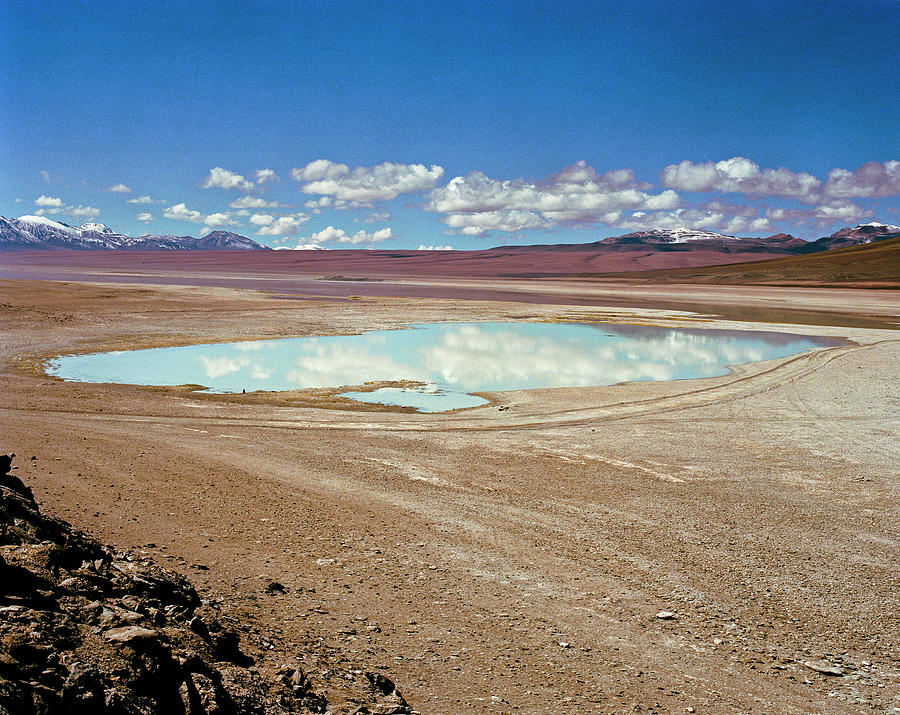 Clouds Reflect In A Small Desert Lake Photograph by Linka A Odom