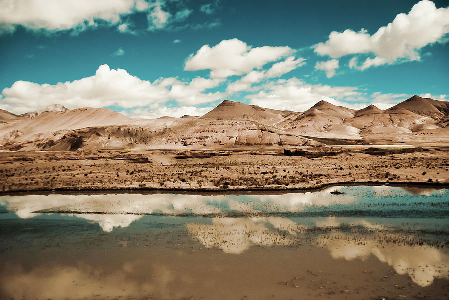 Clouds Reflected In A Lake. Tibet Photograph by Volanthevist