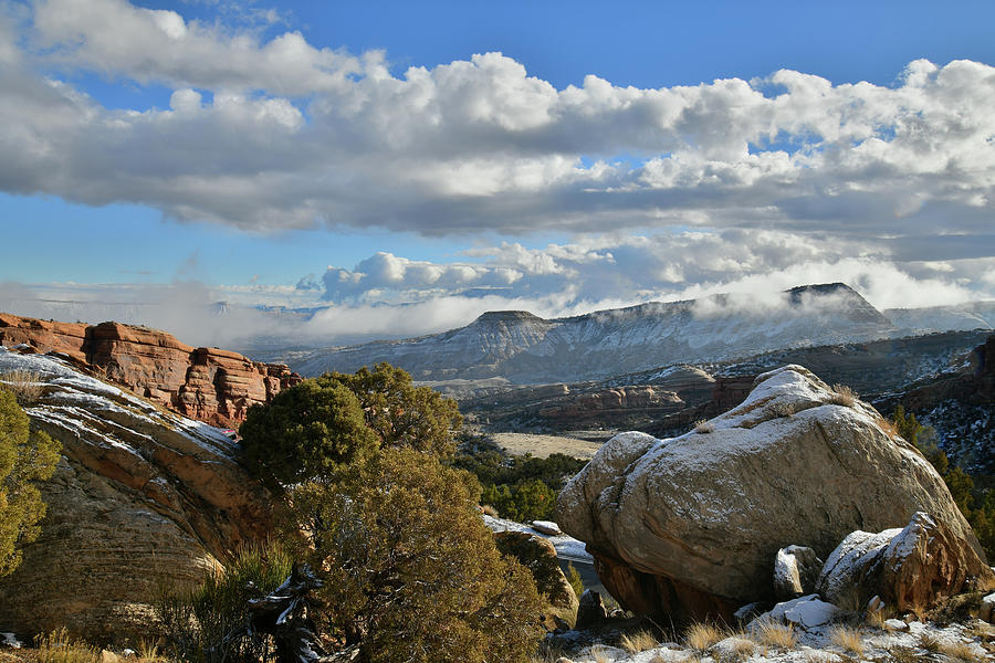 Clouds Roll Over Tabegauche near Colorado National Monument Photograph by Ray Mathis