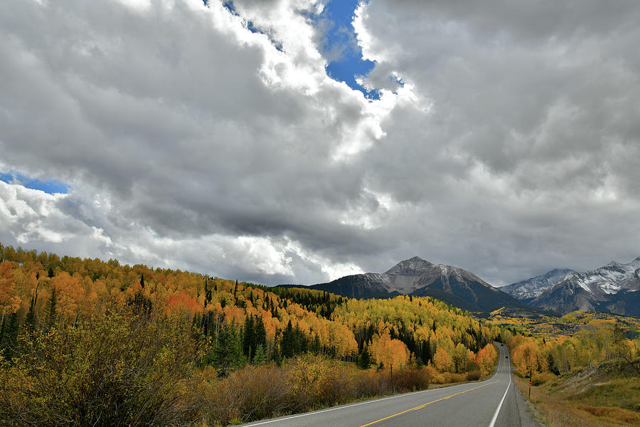 Clouds Split Open over Highway 145 Fall Colors Photograph by Ray Mathis