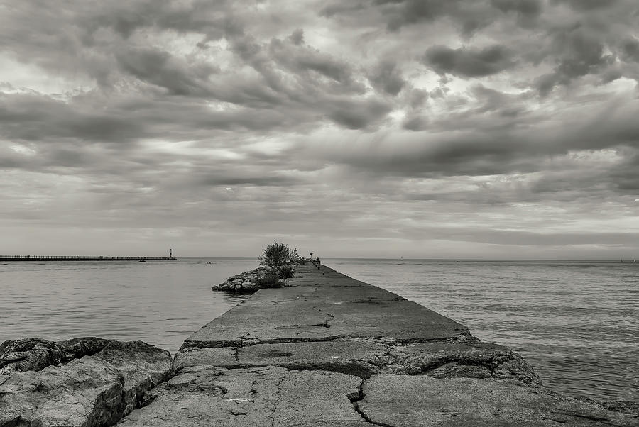 Pier Photograph - Cloudscape Over Pier With Jagged Rocks B&w by Anthony Paladino