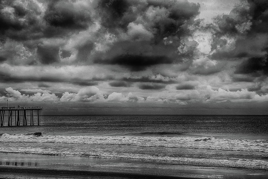 Cloudy day at the Beach Photograph by Alan Goldberg