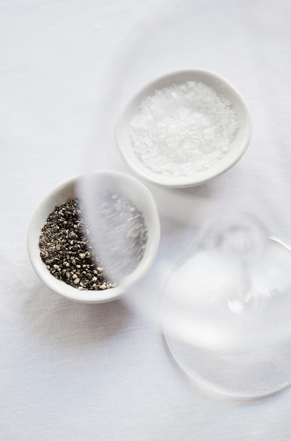 Coarsely Ground Pepper And Salt In White Dishes Photograph by Great Stock!