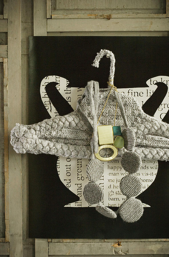 Coat Hanger With Knitted Cover And Knitted Necklace Photograph by Colin Cooke