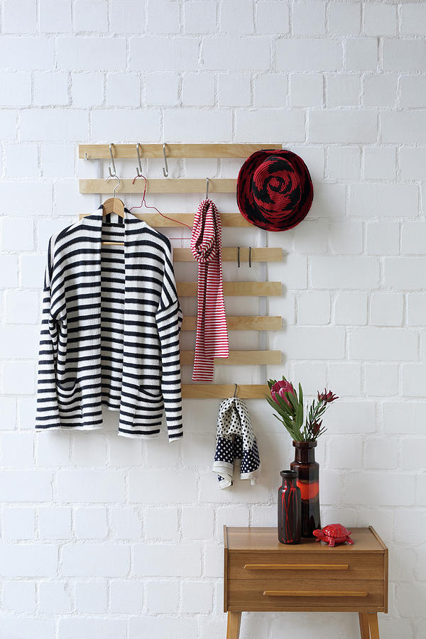 Coat Rack Made From Old Bed Slats On Brick Wall Photograph by Thordis Rggeberg