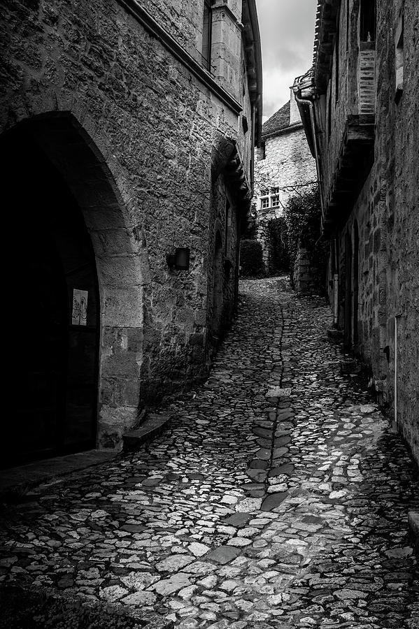 Black And White Photograph - Cobbled Streets of Saint Cirq Lapopie by Georgia Clare