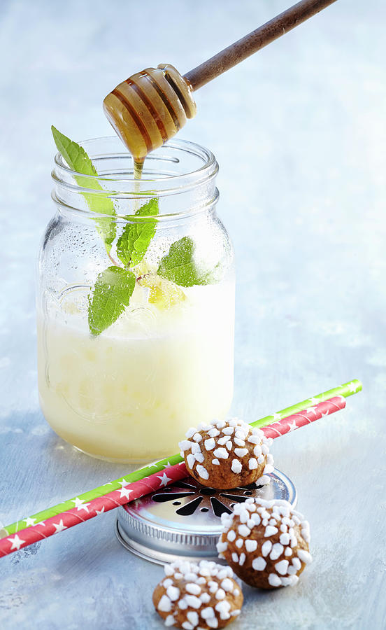 Cocktail With Cachaca, Cream Of Coconut, Cream, Pineapple Juice And Honey In A Jar, Served With Biscuits Photograph by Teubner Foodfoto