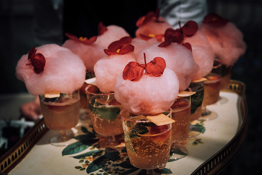 Cocktail With Candyfloss And Bergonia Flower Garnish Photograph by Joan Ransley