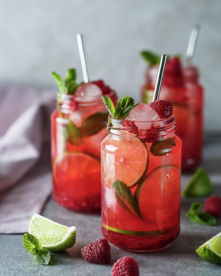 Cocktails With Raspberries, Lime And Mint Photograph by Kristina Zvereva