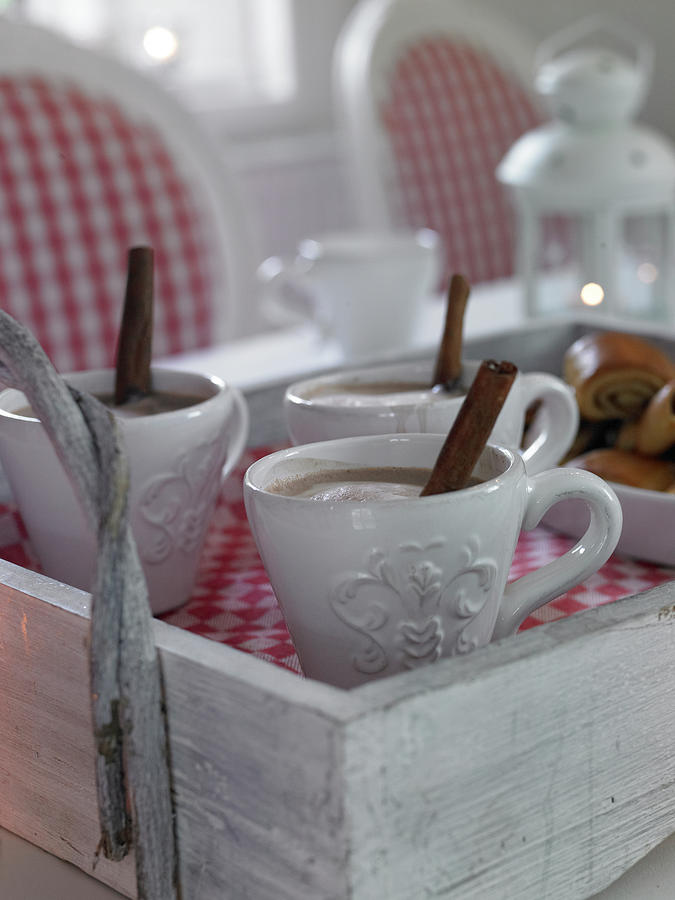 Cocoa In Coffee Mugs With Cinnamon Sticks Photograph by Jalag / Olaf Szczepaniak