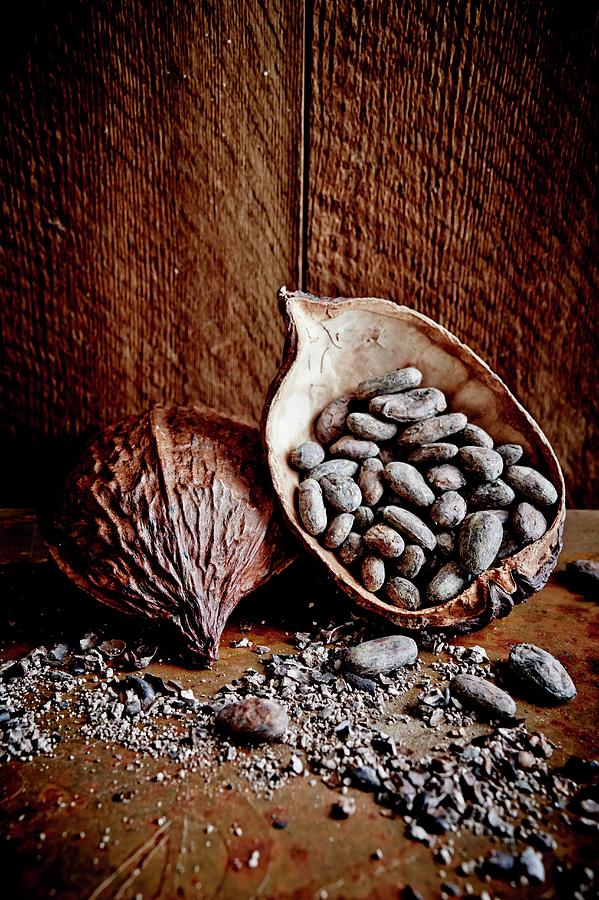Cocoa Pods And Cocoa Beans On A Wooden Surface Photograph by Greg Rannells