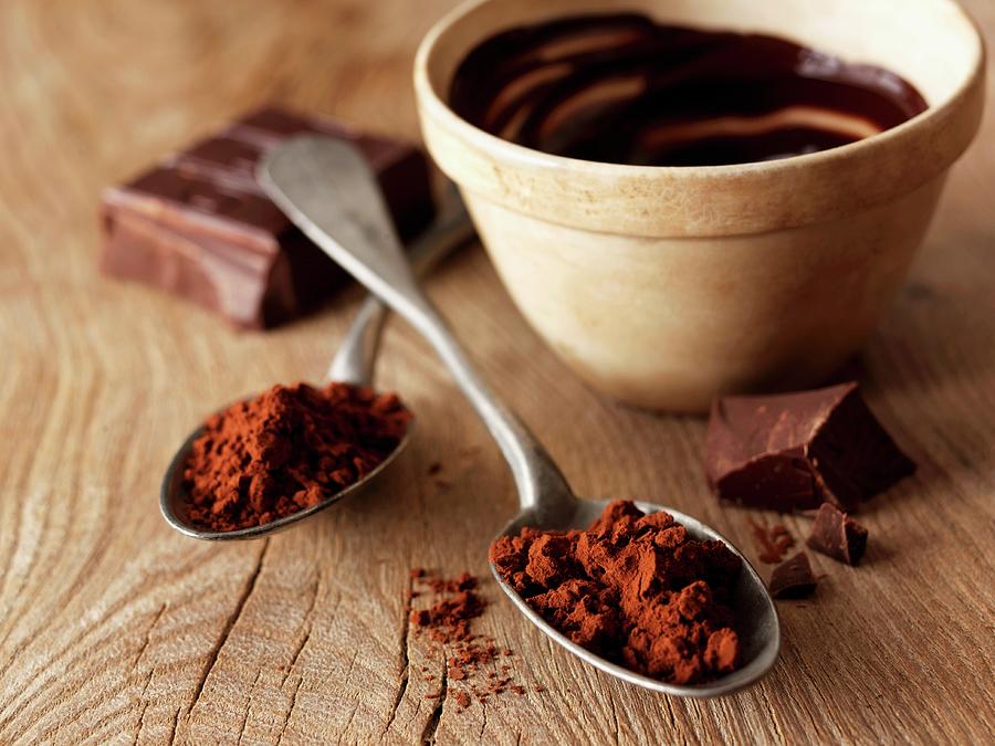 Cocoa Powder On A Spoon And A Bowl Of Dark Cooking Chocolate Photograph by Frank Adam