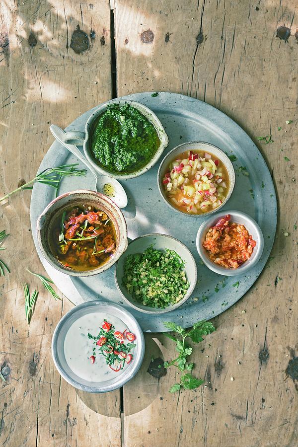 Coconut And Chilli Sauce, Tomato And Rosemary Oil, Herb And Pistachio Pesto, Chervil And Pine Nut Gremolata, Radish And Cucumber Salsa And Ginger And Chilli Paste Photograph by Jalag / Wolfgang Schardt