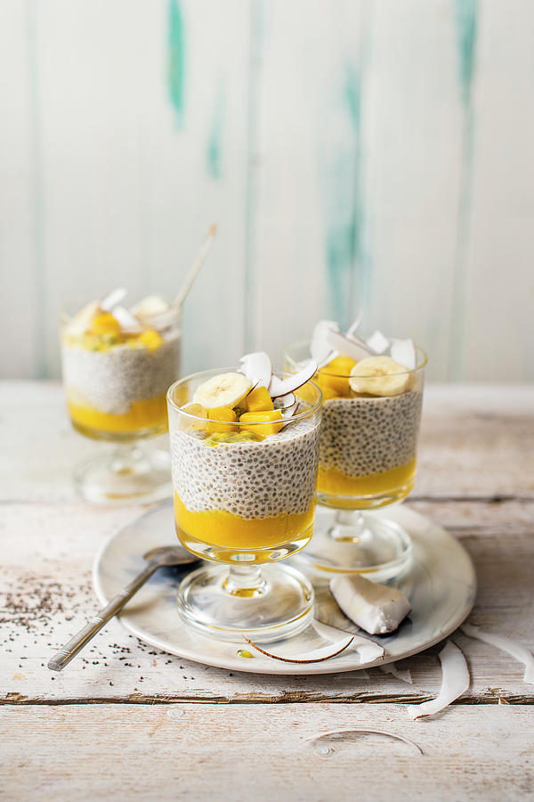Coconut And Mango Chia Pudding In Glasses Photograph by Magdalena Hendey