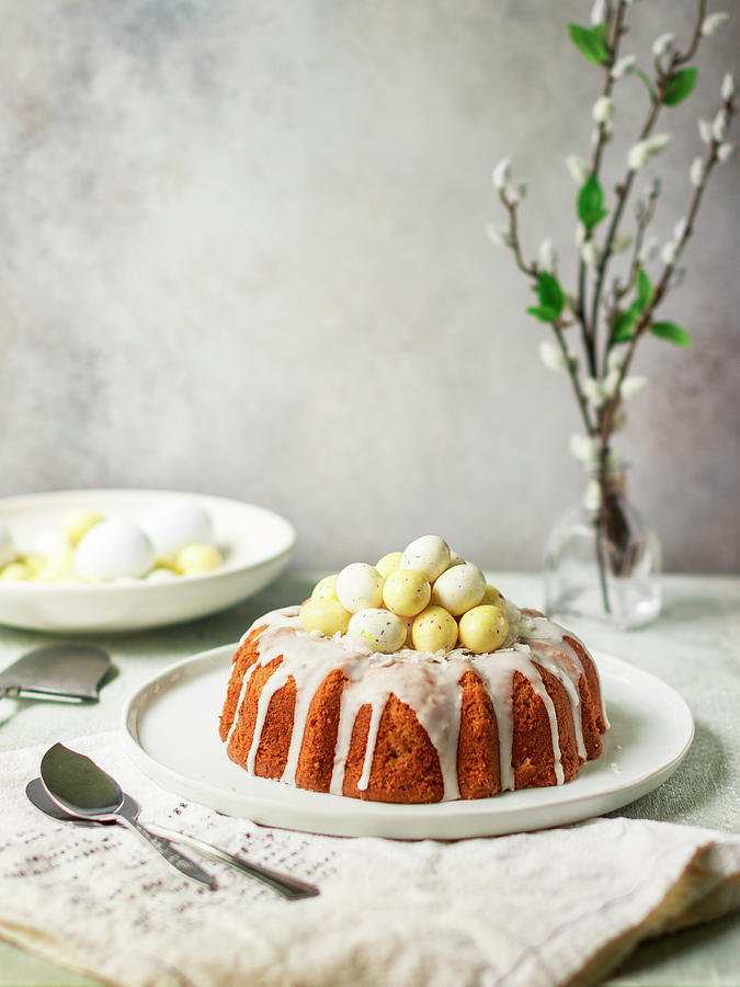 Coconut Easter Cake With White Chocolate Eggs Photograph by Maria Squires