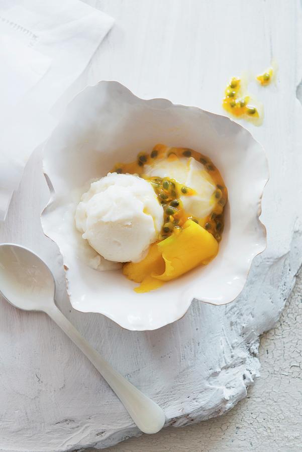 Coconut Ice Cream With Passion Fruit Sauce Photograph by Veronika Studer