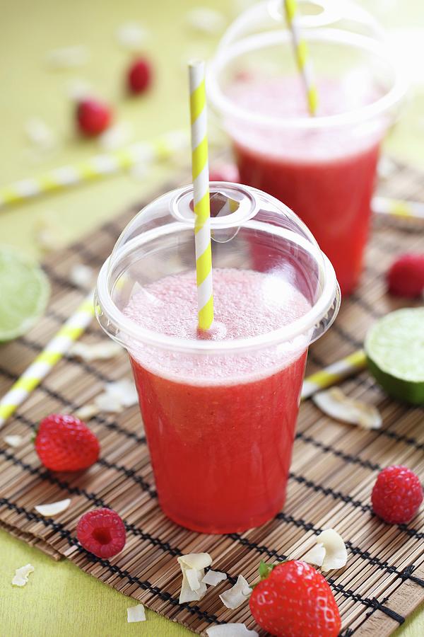 Coconut Juice, Lime, Strawberry And Raspberry Smoothie Photograph by Desgages